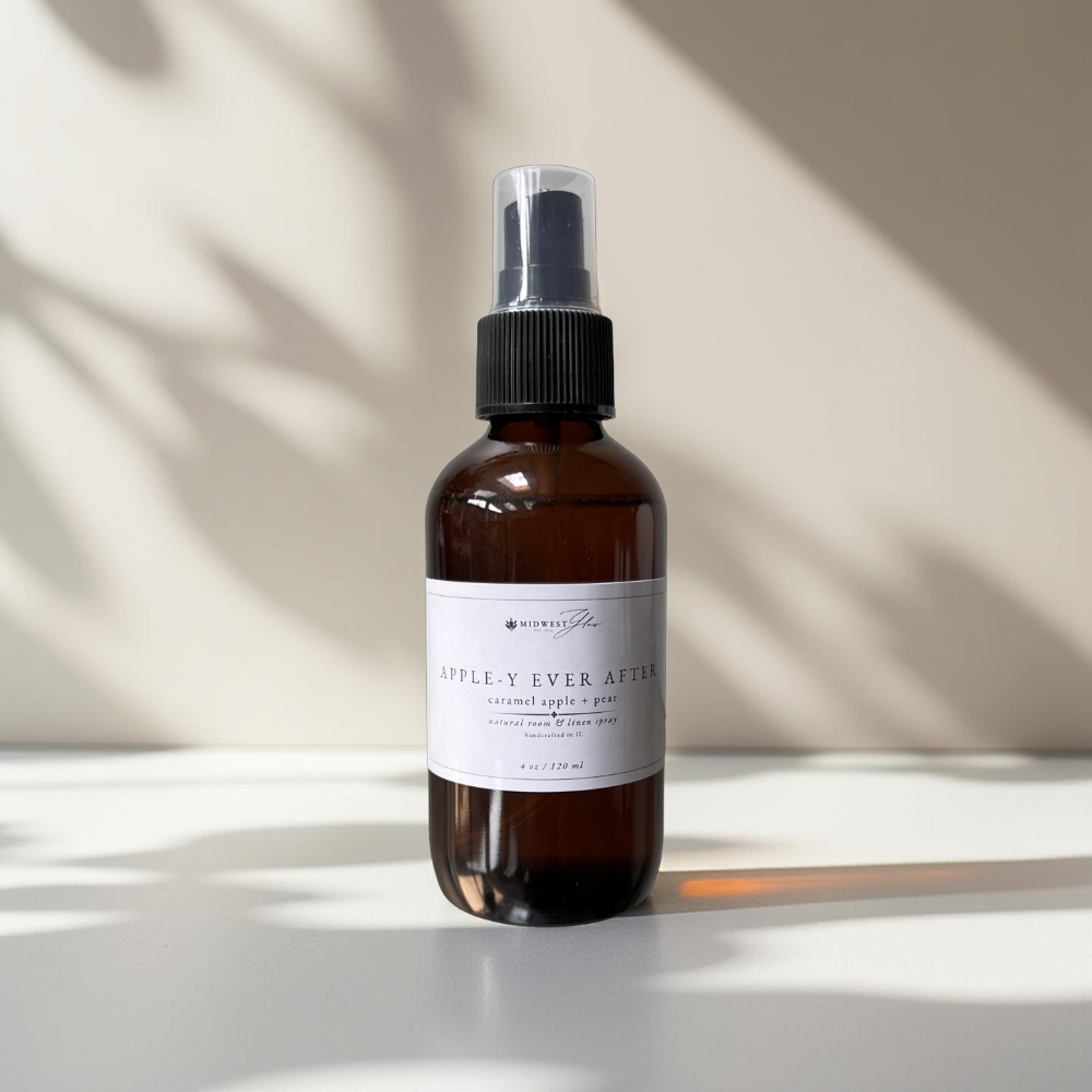 Appley Ever After Room Spray by MIdwest Glow sits against a white backdrop with subtle shadows showcasing the product as part of the new Signature Collection