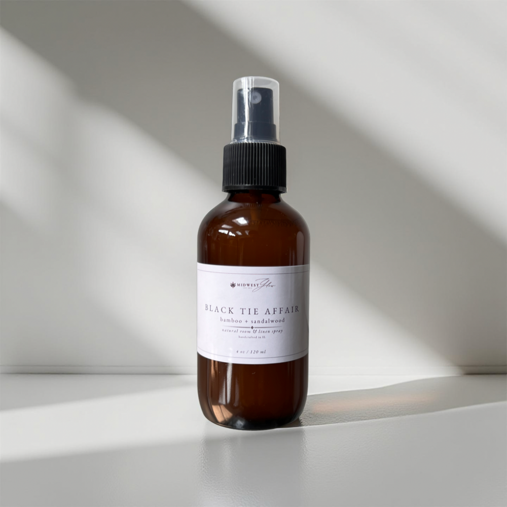 Black Tie Affair Room Spray by Midwest Glow sits against a white backdrop with subtle shadows showcasing the product as part of the new Signature Collection