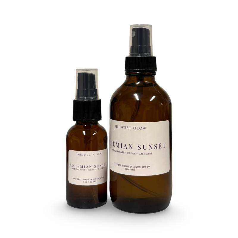 Two brown glass bottles with black sprayers and white labels on a white background