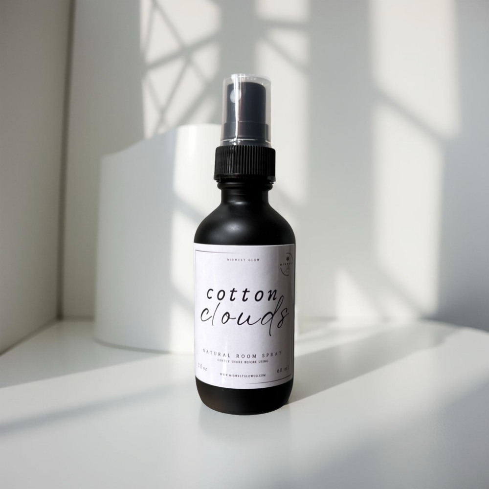 Cotton Clouds Room Spray by Midwest Glow sits against a white backdrop showcasing the product