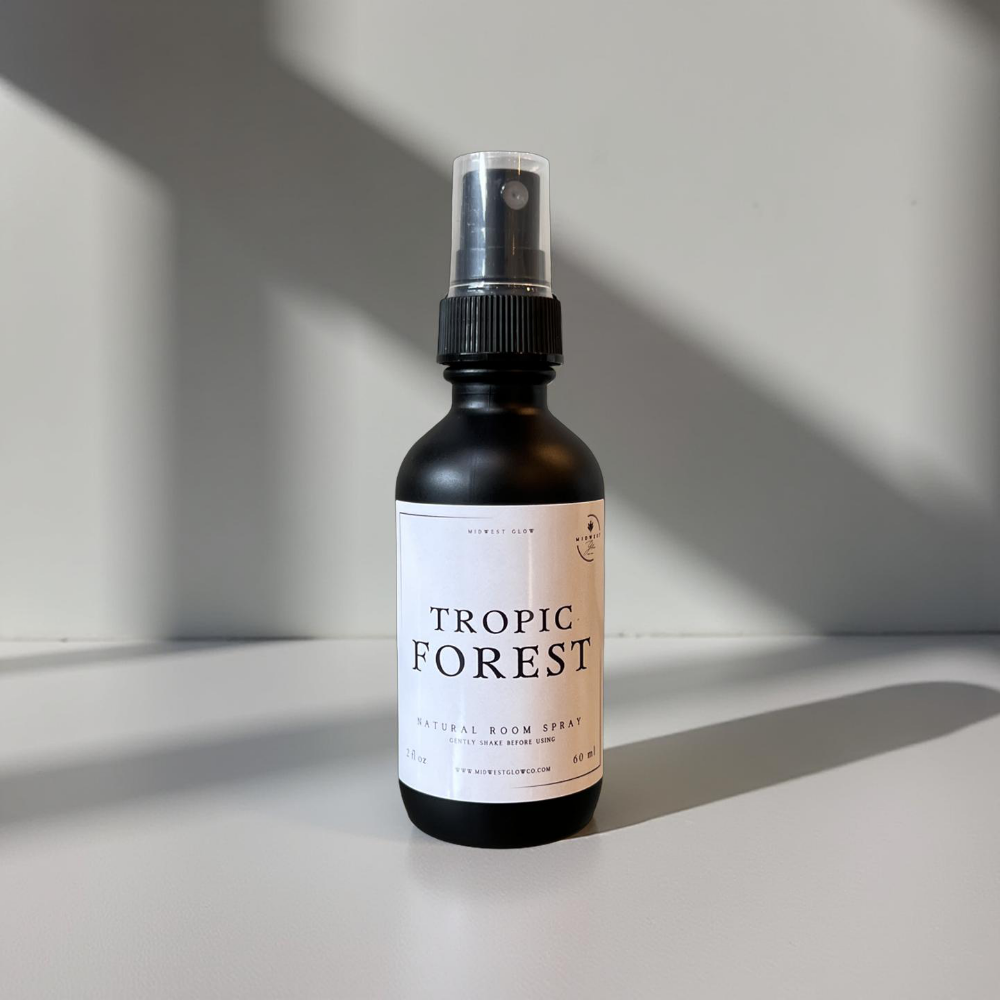 Tropic Forest Room Spray by Midwest Glow sits against a white backdrop showcasing the product