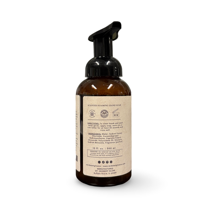 Brown foaming hand soap bottle with label on a white background