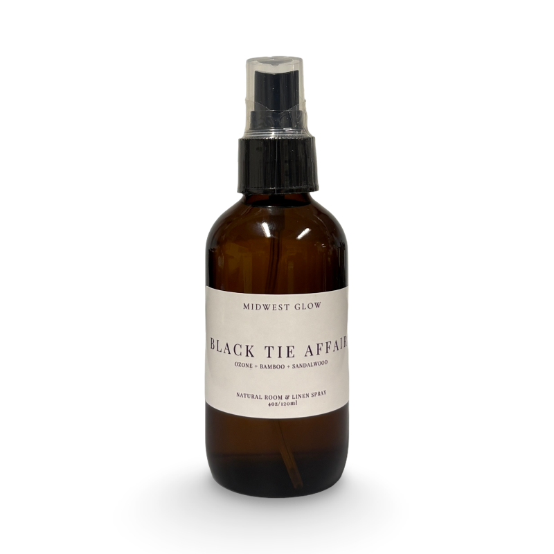 Brown spray bottle labeled 'Black Tie Affair' on a white background
