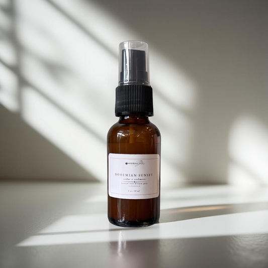 Bohemian sunset spray by Midwest Glow sits against a white photo backdrop with subtle shadows highlighting the product