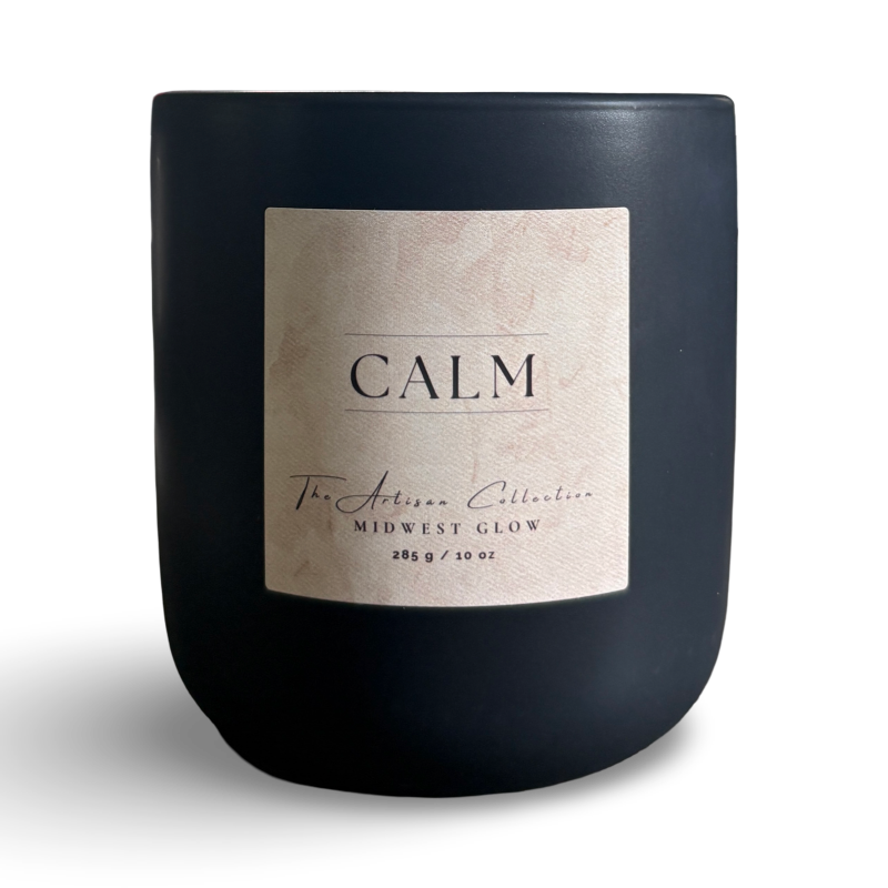 Black candle with a label on a white background