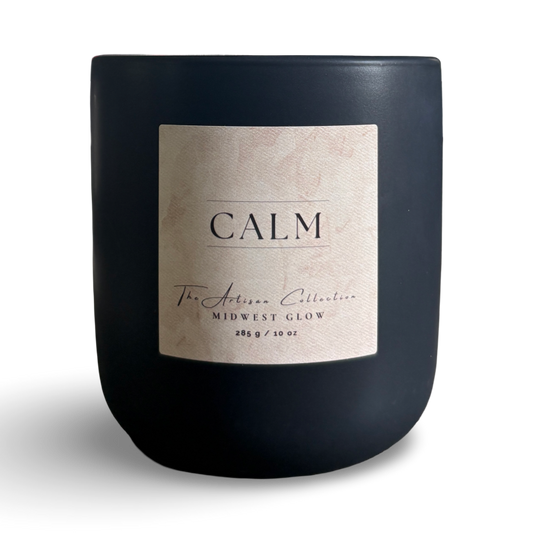 Black candle with a label on a white background