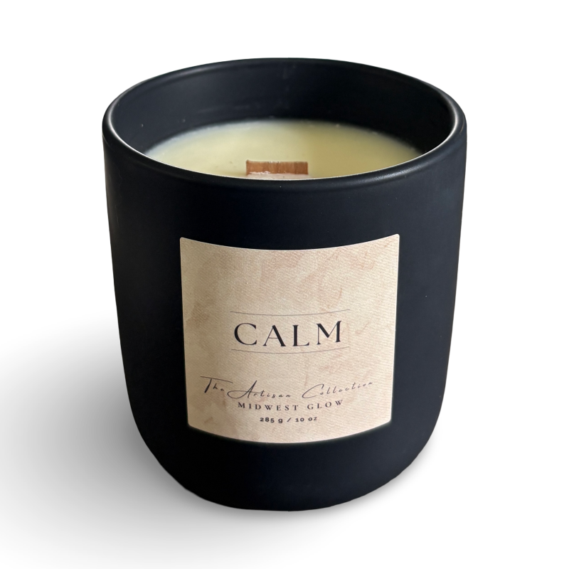 Black candle with a label reading 'Calm' on a white background