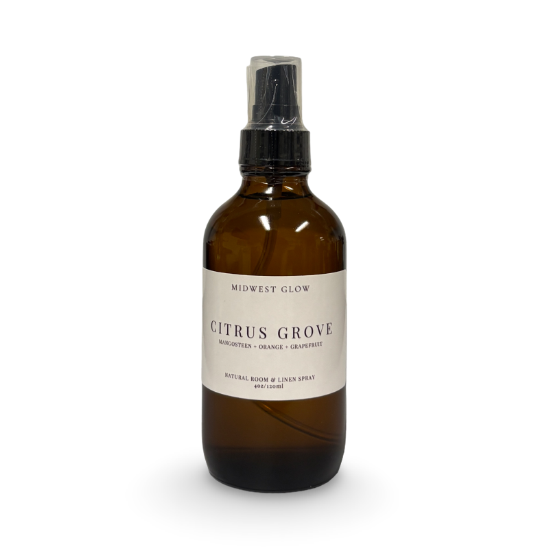 Brown spray bottle labeled 'Citrus Grove' on a white background