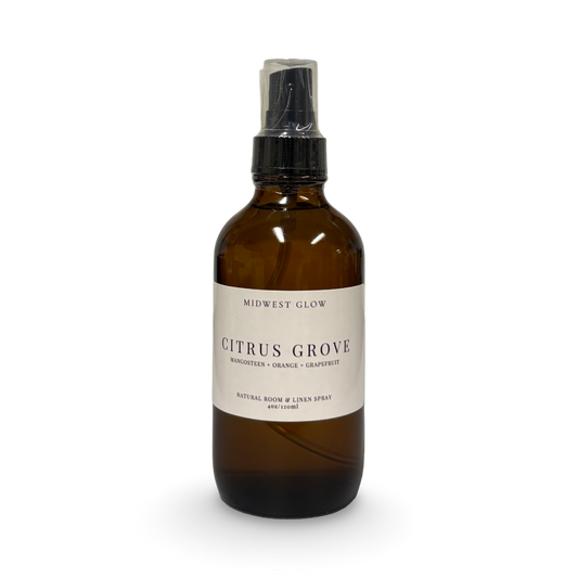 Brown spray bottle labeled 'Citrus Grove' on a white background