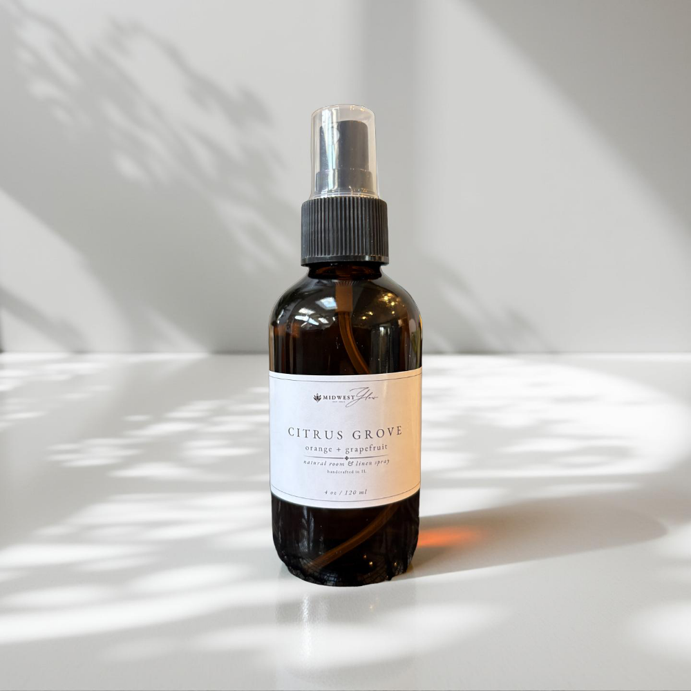 Bottle of 'Citrus Grove' spray on a light background