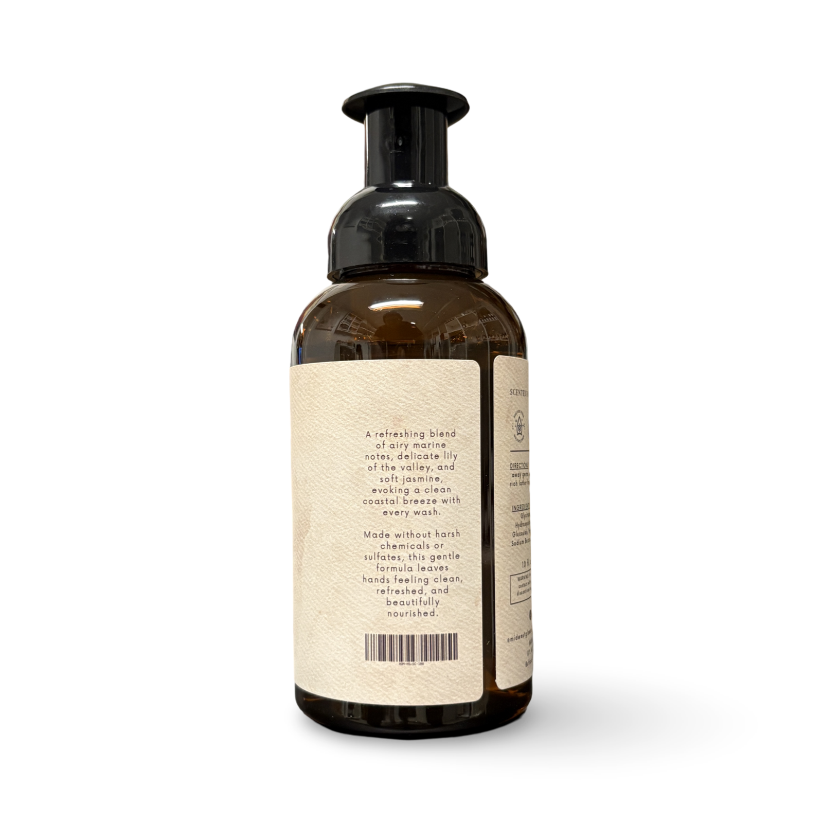 Brown bottle with pump and beige label on a white background