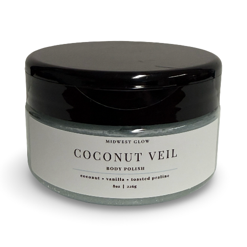 A jar of Midwest Glow Coconut Veil Body Polish with a black lid and a white label, set against a plain white background.