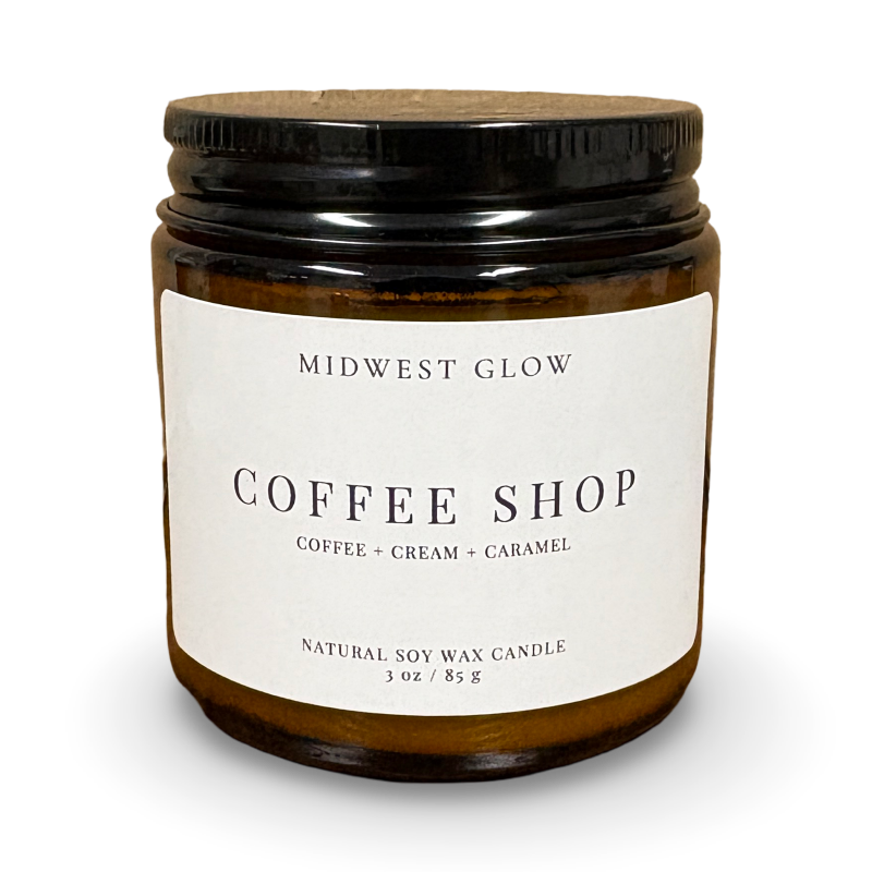 Candle jar labeled 'Midwest Glow Coffee Shop' on a white background