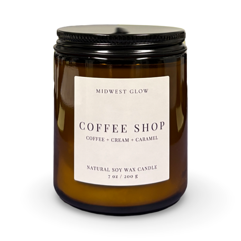 Amber glass candle with a label on a white background