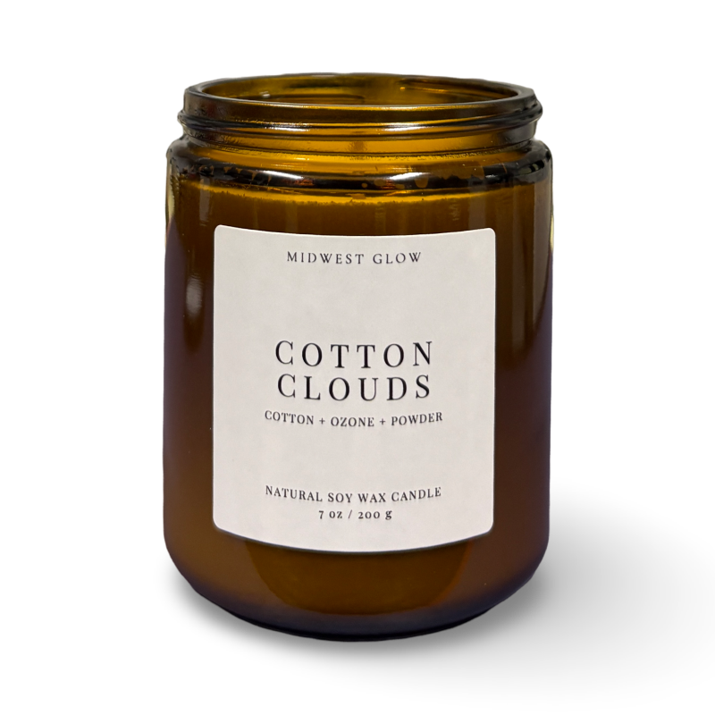Brown candle jar with 'Cotton Clouds' label on a white background