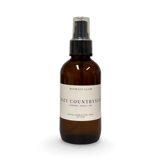 Brown spray bottle labeled 'Cozy Countryside' on a white background