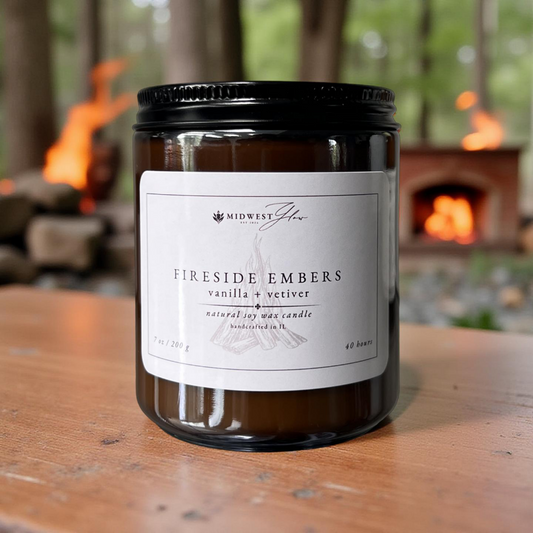 Candle labeled 'Fireside Embers' with a fireplace in the background