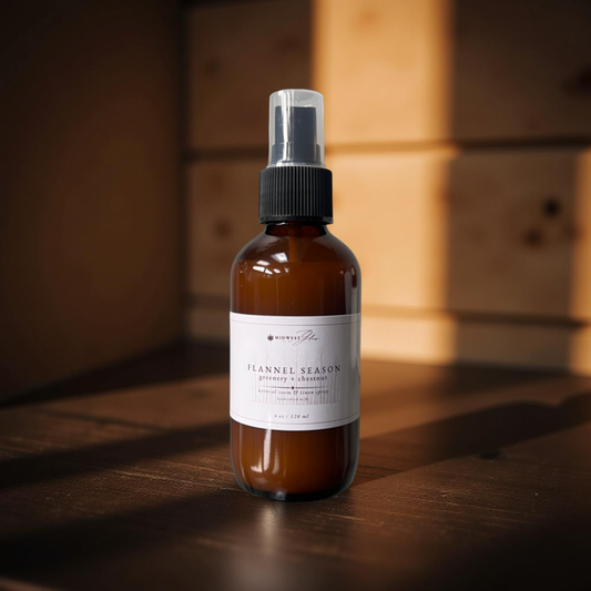 Brown spray bottle with a label on a wooden surface