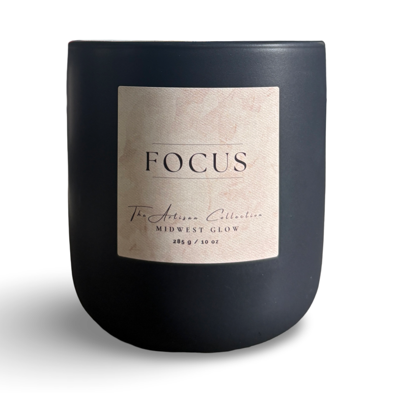 Black candle with a 'Focus' label on a white background