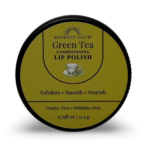 A round black-lidded jar of Midwest Glow Green Tea Conditioning Lip Polish on a white background with a soft shadow.