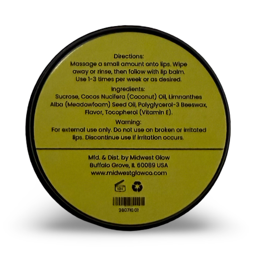The back of a round black cosmetic jar lid with printed directions, ingredients, and warning text on a muted olive-gold background, photographed on a white background.