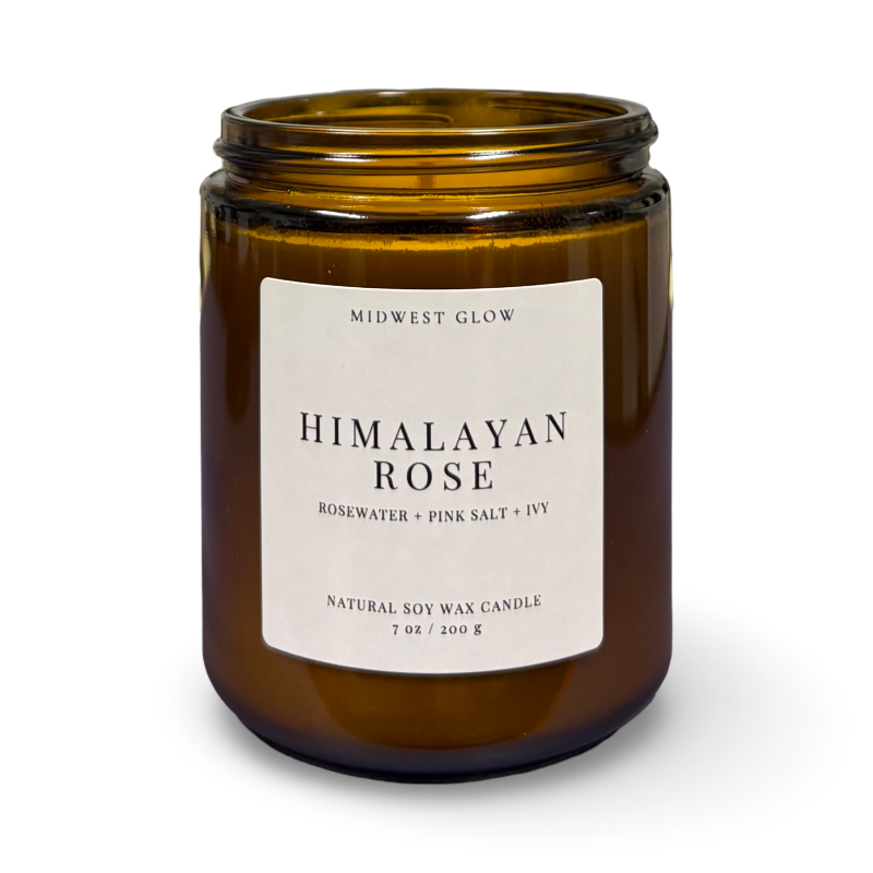 Brown candle jar with 'Himalayan Rose' label on a white background