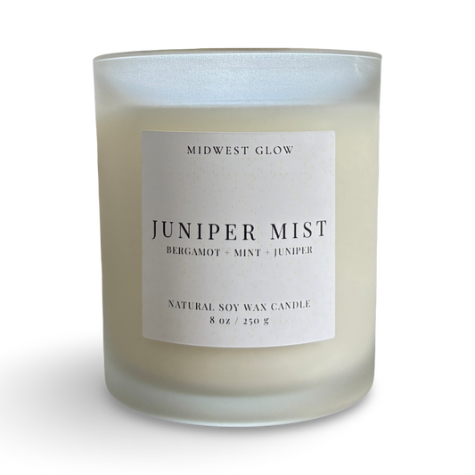 Candle labeled 'Juniper Mist' by Midwest Glow on a white background