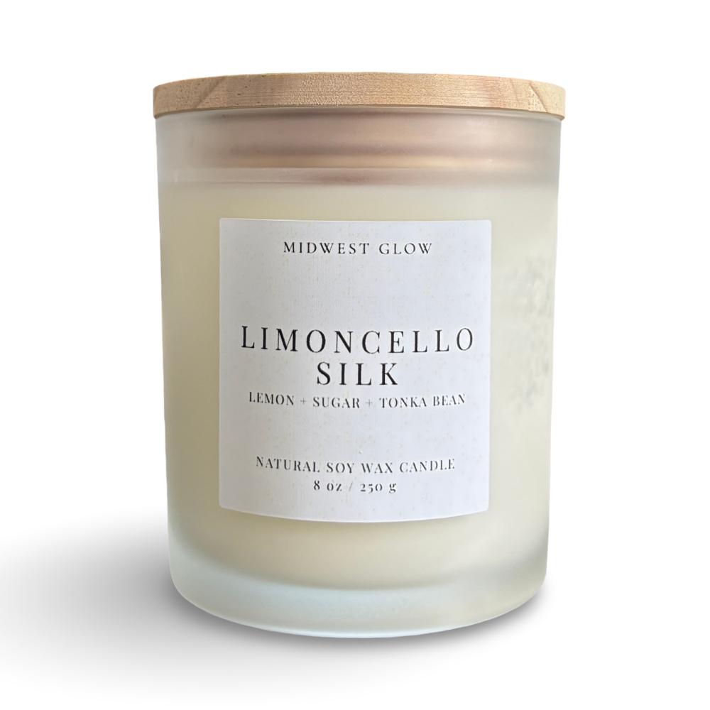 Candle with a wooden lid labeled 'Limoncello Silk' by Midwest Glow on a white background