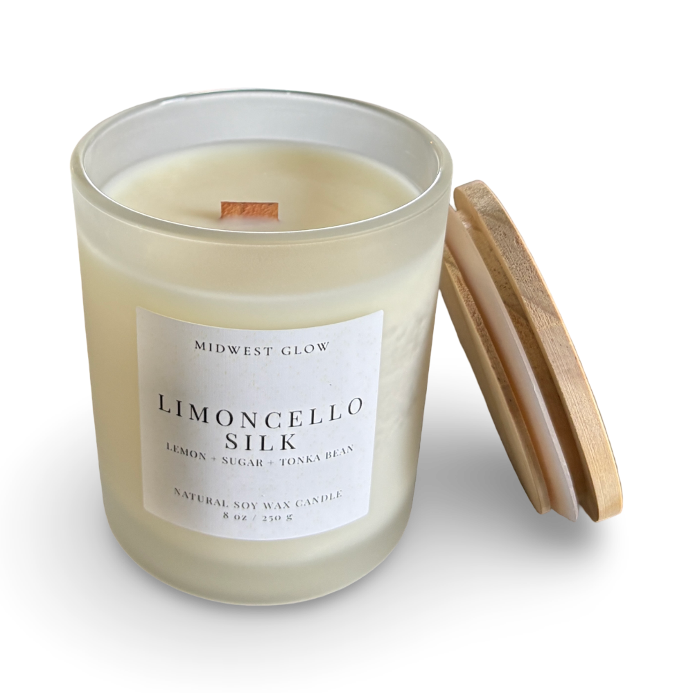 Candle with a wooden lid labeled 'Limoncello Silk' by Midwest Glow on a white background