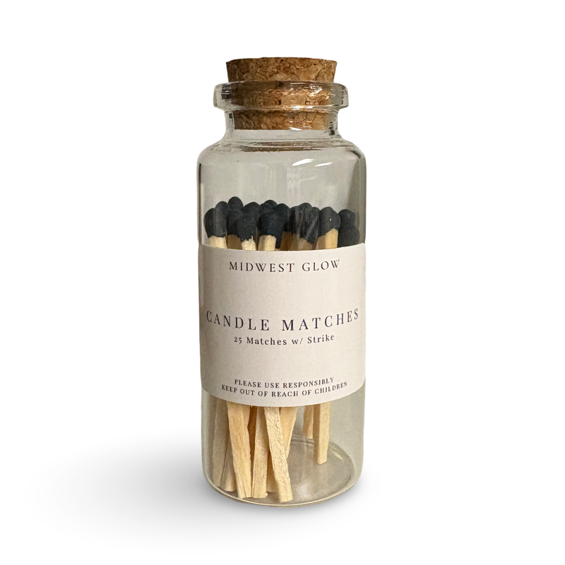 Jar of candle matches with cork lid on a white background