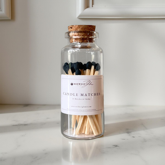 A jar of candle matches with the Midwest glow logo 
