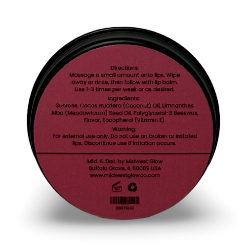 Round black-lidded jar of lip balm shown from the back, with a dark red label containing product directions, ingredients, and branding for Midwest Glow.
