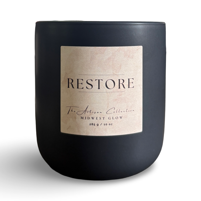 Black candle with a 'Restore' label on a white background