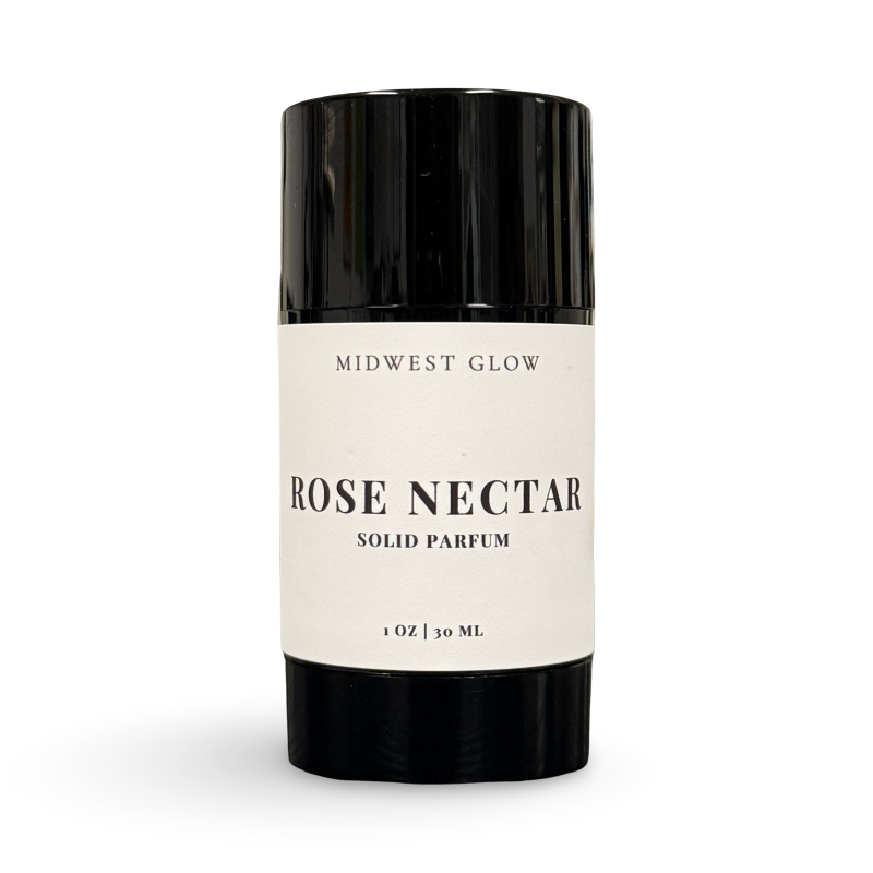 Solid perfume stick labeled 'Rose Nectar' by 'Midwest Glow' on a white background
