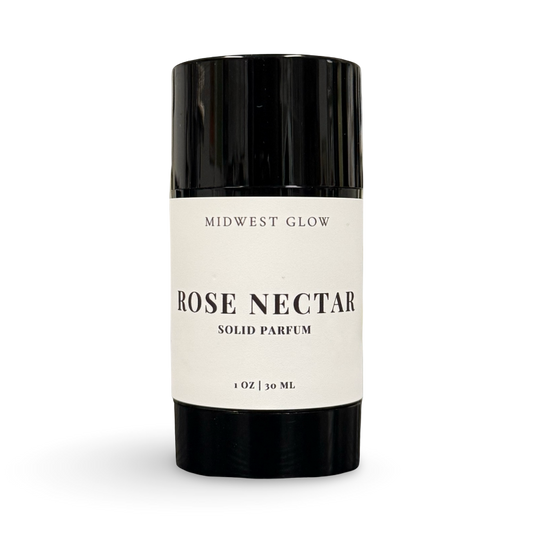 Solid perfume stick labeled 'Rose Nectar' by 'Midwest Glow' on a white background