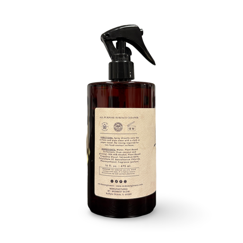 Brown spray bottle with a label on a white background