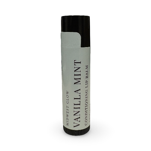 A single tube of Midwest Glow Vanilla Mint Conditioning Lip Balm, featuring a light gray label with black text and a black cap, set against a plain white background.