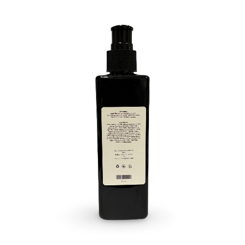 Black lotion bottle with an ingredients label on a white background
