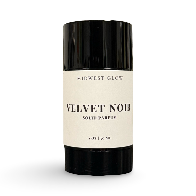 Solid perfume stick labeled 'Velvet Noir' by 'Midwest Glow' on a white background