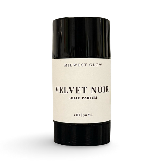 Solid perfume stick labeled 'Velvet Noir' by 'Midwest Glow' on a white background