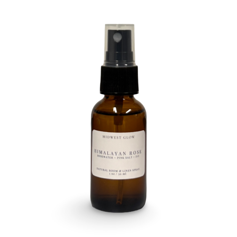 Brown spray bottle with a label on a white background